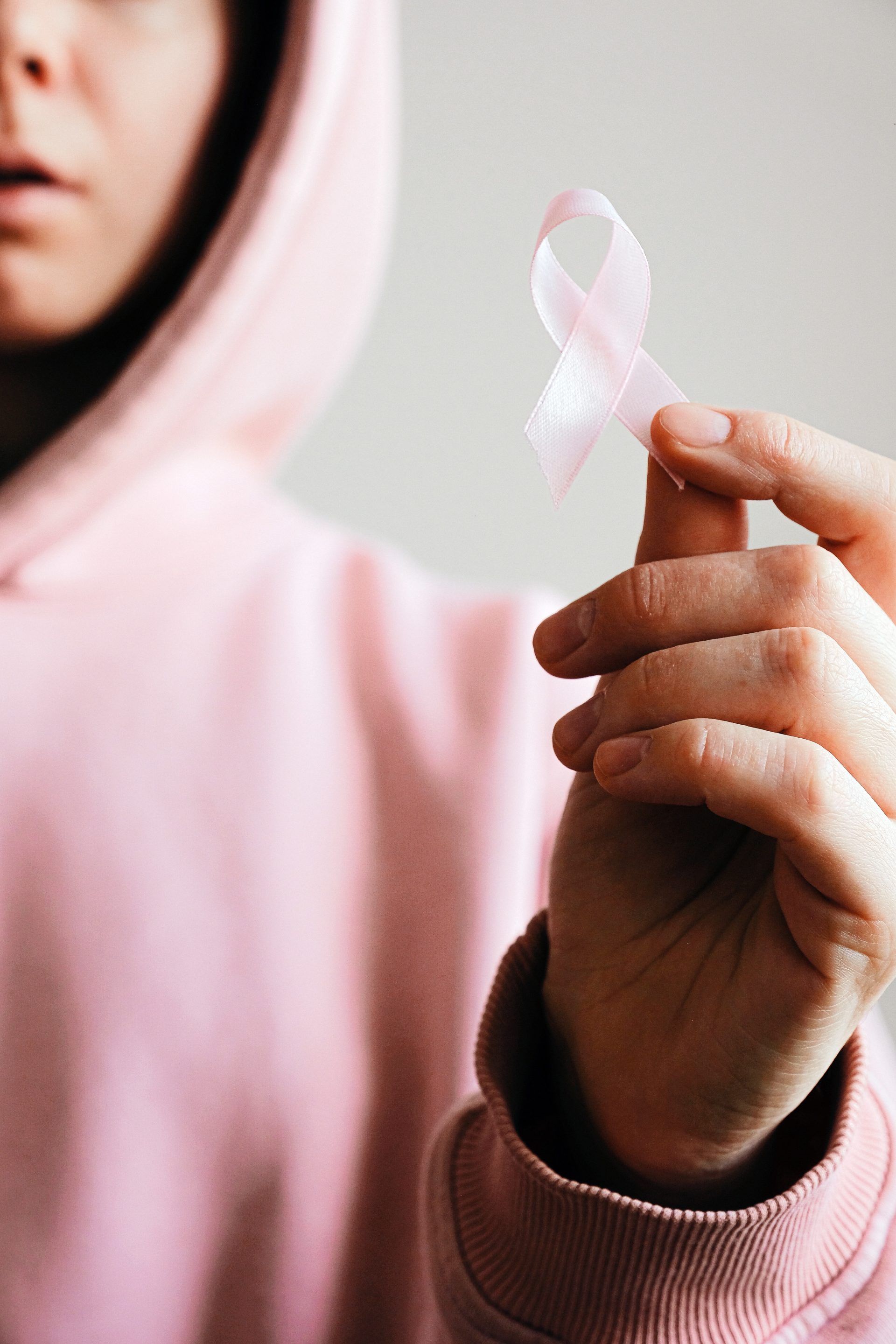 cbd oil and cancer patient holding ribbon