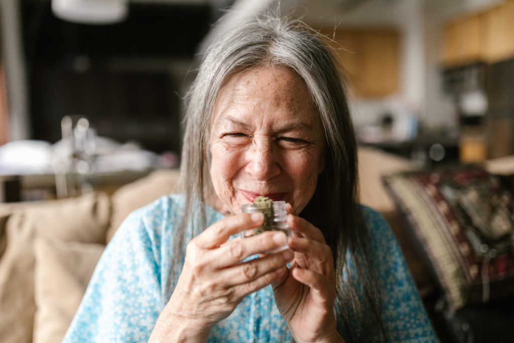 older woman smelling cannabis